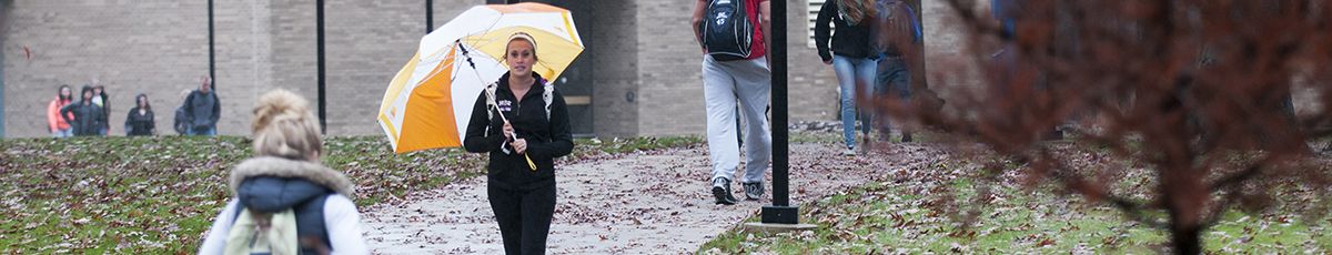 Students in the Rain at Student Center in Sugar Grove