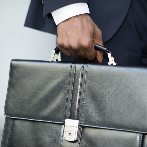 businessman holding his briefcase