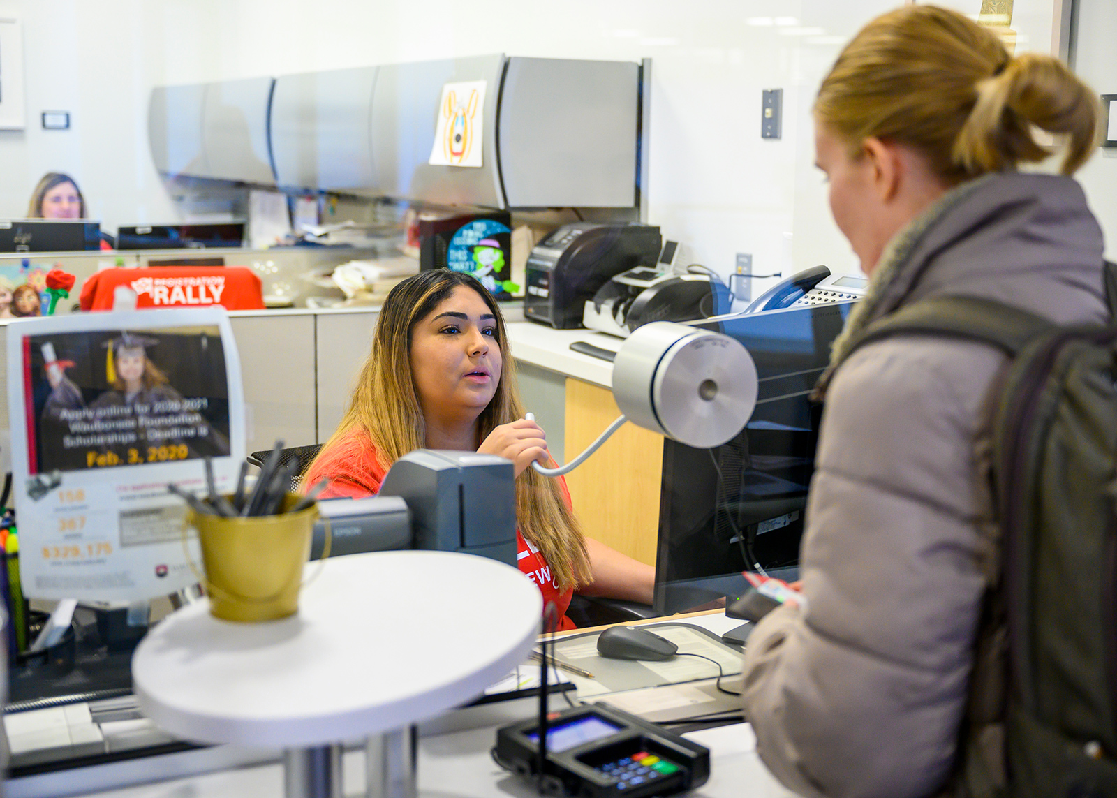 Student at the Student Accounts and Cashier Office window