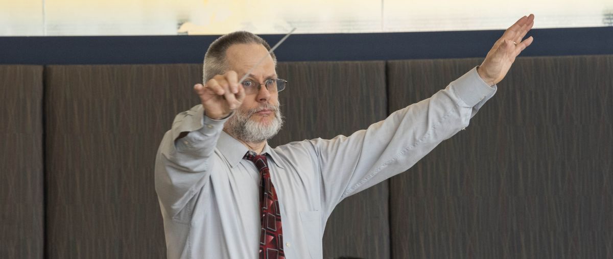 Dr. Mark Lathan conducting music class