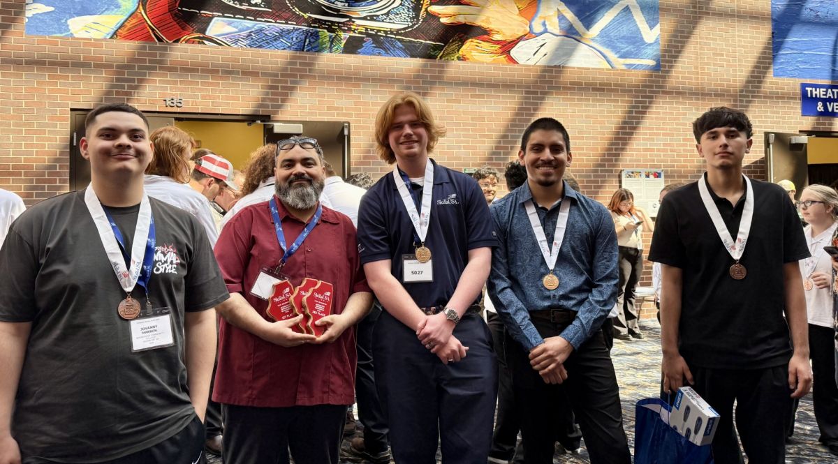 Waubonsee students Jovanny Marron, Ben Swanson, Alex Soto, and Javier Solis join Instructor Ramiro Cervantes (second from left) at the SkillsUSA Illinois State Championships.