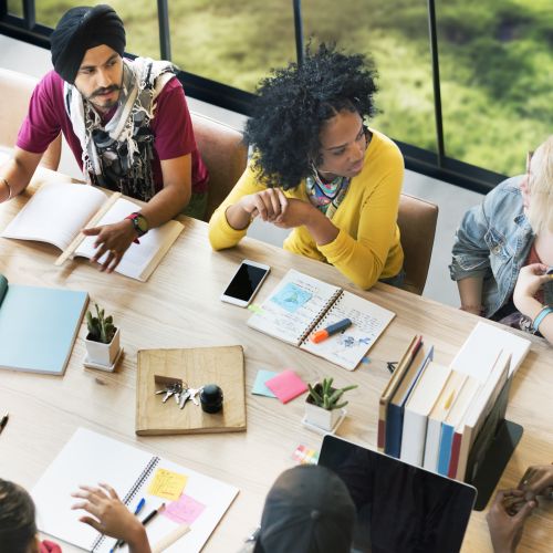 overhead view of group meeting at a conference table