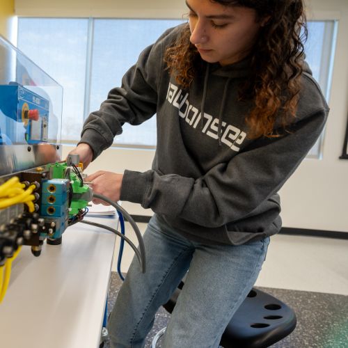 Industrial Maintenance Student working on simulator
