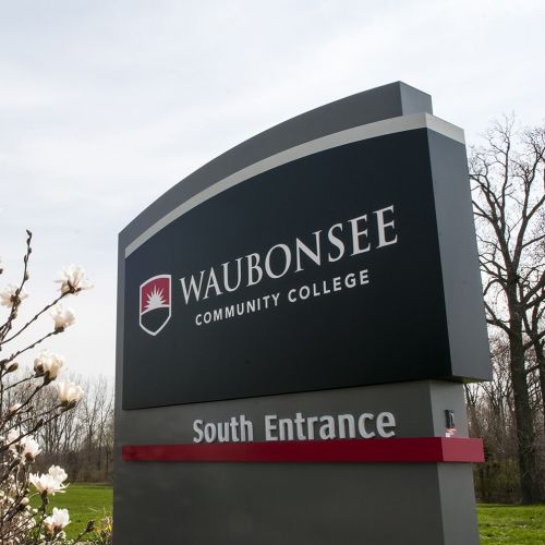 Waubonsee South Entrance sign spring flowers