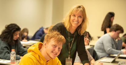 Kathleen Randall - Professor of Education helping a student in class