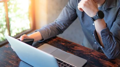 man working on laptop at home